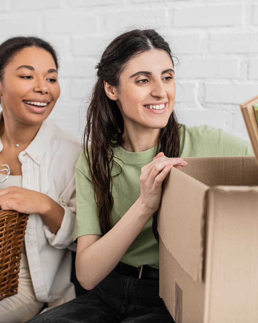 Two women laughing over a finished box